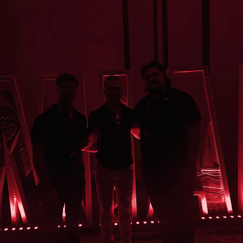 Three teammates at the Pinnacle summit in Miami